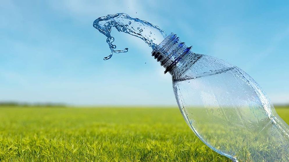 bottled-water-splash-on-grassy-field